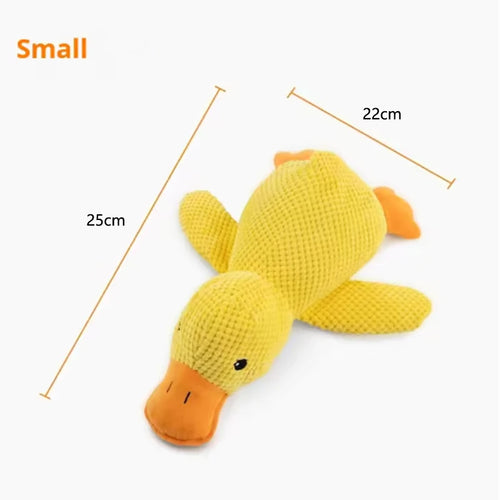 Dog sleeping with a dog hug duck toys to relieve boredom of little
